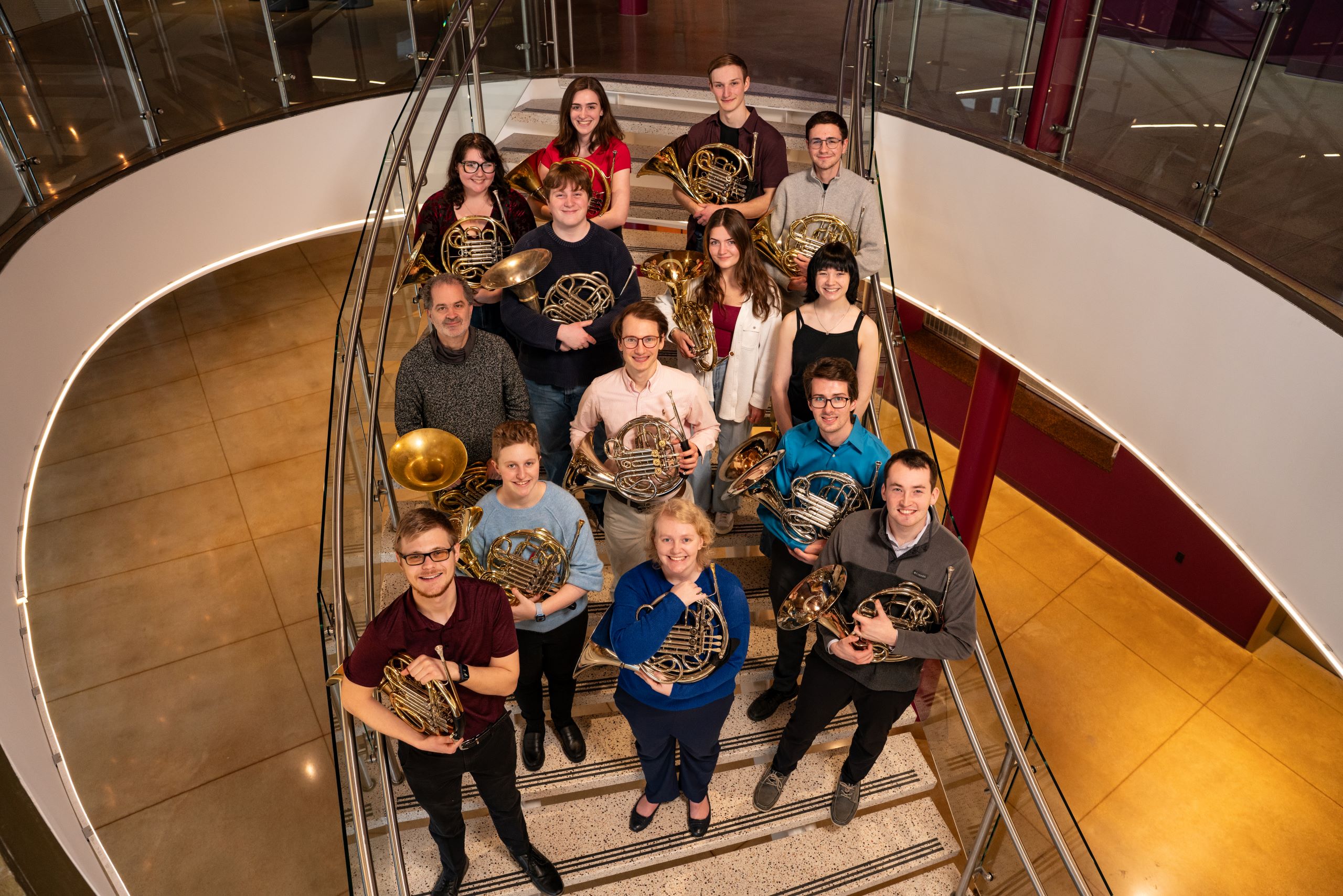 Group of people holding musical instruments